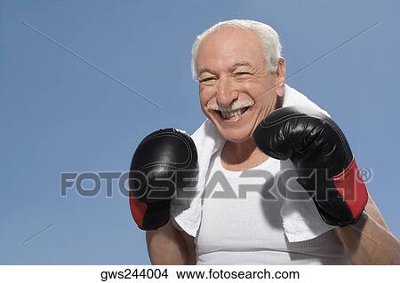 Picture - Close-up of a senior man in boxing pose. Fotosearch