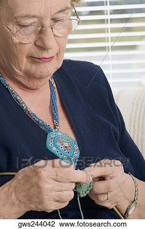 Close-up of a senior woman knitting View Large Photo Image Stock Image - Close-up of a senior woman knitting. Fotosearch