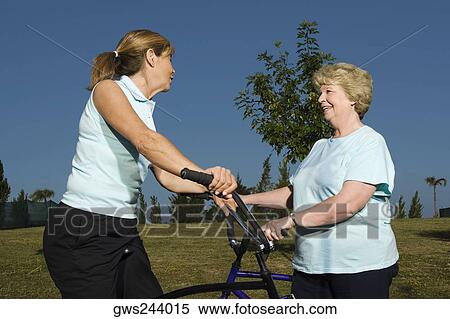 Side profile of two senior women talking to each other View Large Photo Image Stock Photography - Side profile of two senior women talking to each other. Fotosearch