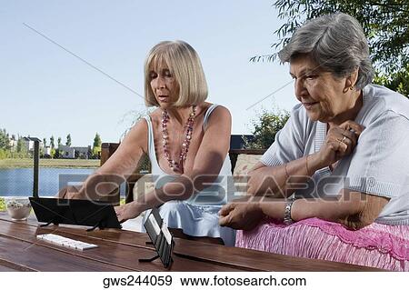 Two senior women playing games View Large Photo Image Stock Photo - Two senior women playing games. Fotosearch
