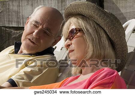 Close-up of a senior couple sitting together View Large Photo Image Picture - Close-up of a senior couple sitting together. Fotosearch
