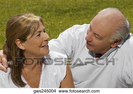 Senior couple sitting in a park View Large Photo Image Picture - Senior couple sitting in a park. Fotosearch