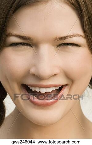 Portrait of a young woman laughing View Large Photo Image Picture - Portrait of a young woman laughing. Fotosearch