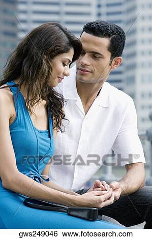 Stock Photograph - Close-up of a couple holding each other's hands. Fotosearch