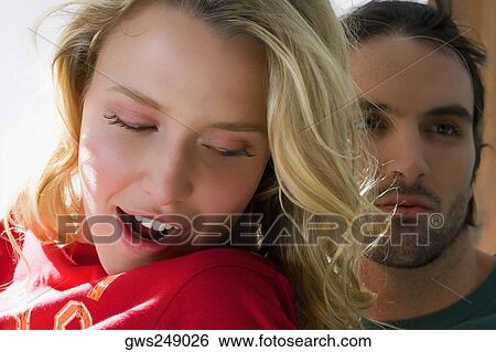 Close-up of a young couple View Large Photo Image Stock Photograph - Close-up of a young couple. Fotosearch