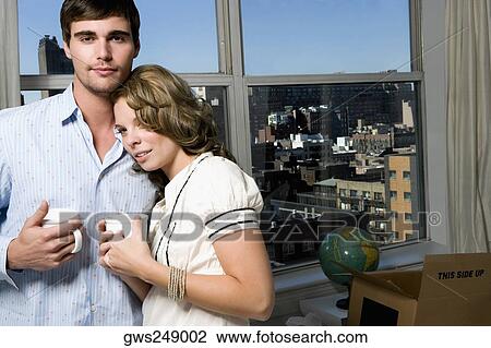 Portrait of a young couple having coffee View Large Photo Image Stock Image - Portrait of a young couple having coffee. Fotosearch