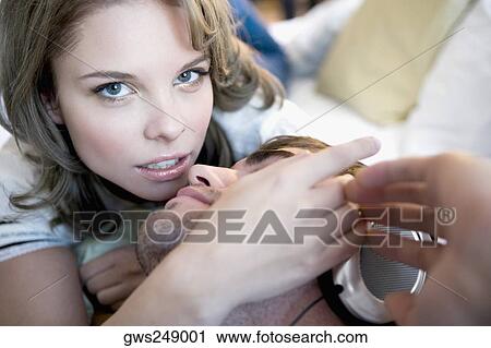 Stock Image - Portrait of a young couple romancing. Fotosearch
