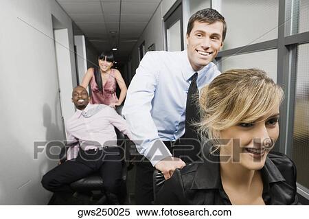 Office workers playing in an office View Large Photo Image Stock Photography - Office workers playing in an office. Fotosearch