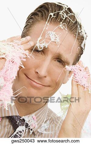 Portrait of a businessman covered with silly string View Large Photo Image Stock Image - Portrait of a businessman covered with silly string. Fotosearch