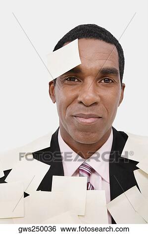 Portrait of a businessman covering with adhesive notes and smiling View Large Photo Image Stock Photograph - Portrait of a businessman covering with adhesive notes and smiling. Fotosearch