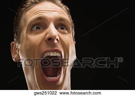 Stock Image - Close-up of a businessman shouting. Fotosearch