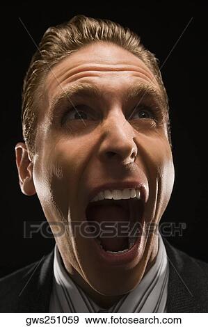 Close-up of a businessman shouting View Large Photo Image Stock Photo - Close-up of a businessman shouting. Fotosearch