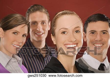 Portrait of four business executives smiling View Large Photo Image Stock Image - Portrait of four business executives smiling. Fotosearch