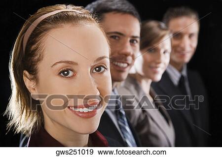 Portrait of four business executives smiling View Large Photo Image Stock Photo - Portrait of four business executives smiling. Fotosearch