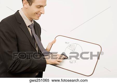 Side profile of a businessman rubbing pie chart with his tie and smiling View Large Photo Image Stock Photography - Side profile of a businessman rubbing pie chart with his tie and smiling. Fotosearch