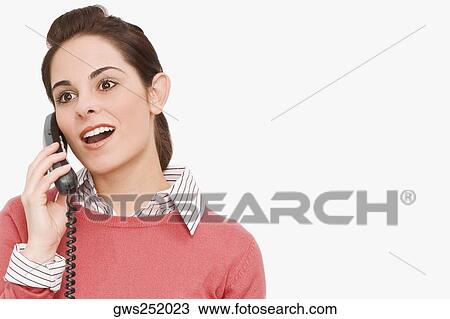 Stock Image - Close-up of a businesswoman talking on the telephone. Fotosearch