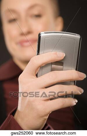Close-up of a businesswoman text messaging View Large Photo Image Stock Image - Close-up of a businesswoman text messaging. Fotosearch