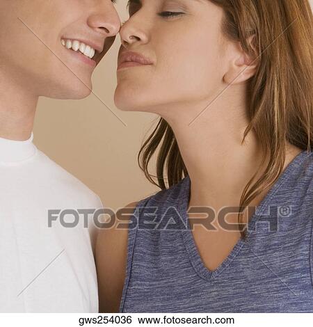 Close-up of a young couple rubbing their noses View Large Photo Image Stock Photograph - Close-up of a young couple rubbing their noses. Fotosearch