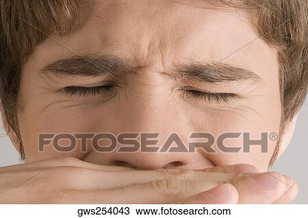 Close-up of a young man with his eyes closed View Large Photo Image Stock Image - Close-up of a young man with his eyes closed. Fotosearch