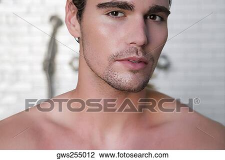 Close-up of a young man thinking View Large Photo Image Stock Image - Close-up of a young man thinking. Fotosearch