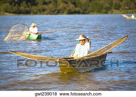 Fishermen with butterfly fishing nets in a lake View Large Photo Image Stock Photo - Fishermen with butterfly fishing nets in a lake. Fotosearch