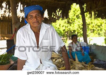 Portrait of a mature man with his wife in the background, Papantla, Veracruz, Mexico View Large Photo Image Stock Photo - Portrait of a mature man with his wife in the background, Papantla, Veracruz, Mexico. Fotosearch