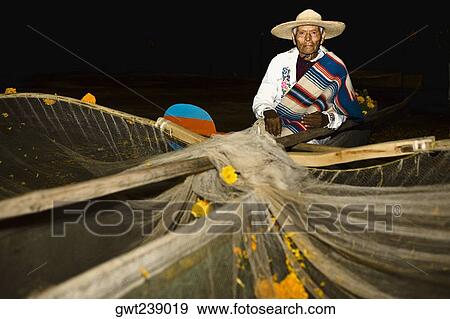 Portrait of a senior man with butterfly fishing net at night View Large Photo Image Stock Photo - Portrait of a senior man with butterfly fishing net at night. Fotosearch