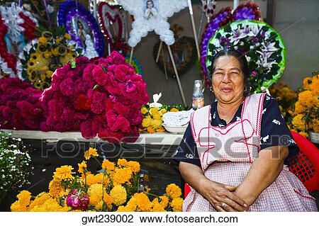 Senior woman selling flowers, San Juan Nuevo, Michoacan State, Mexico View Large Photo Image Stock Image - Senior woman selling flowers, San Juan Nuevo, Michoacan State, Mexico. Fotosearch