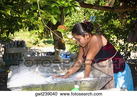 Young woman washing clothes, Papantla, Veracruz, Mexico View Large Photo Image Stock Image - Young woman washing clothes, Papantla, Veracruz, Mexico. Fotosearch