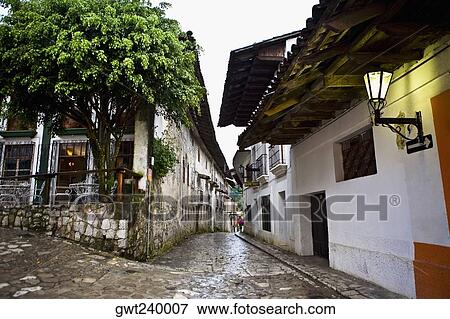 Buildings on both sides of a street, Cuetzalan, Puebla State, Mexico View Large Photo Image Stock Photo - Buildings on both sides of a street, Cuetzalan, Puebla State, Mexico. Fotosearch