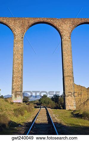 Railroad track passing through an arcade, Arcos Del Padre Tembleque, Tepeyahualco, Hidalgo, Mexico View Large Photo Image Stock Photo - Railroad track passing through an arcade, Arcos Del Padre Tembleque, Tepeyahualco, Hidalgo, Mexico. Fotosearch