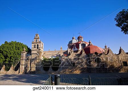 Stock Image - Trees in front of a church, Iglesia Del Carmen, Morelia, Michoacan State, Mexico. Fotosearch