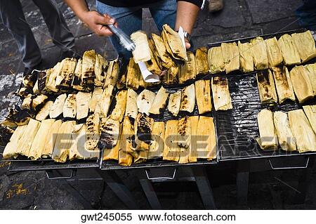Stock Photography - Mid section view of a man selling tamales, Zacatecas State, Mexico. Fotosearch