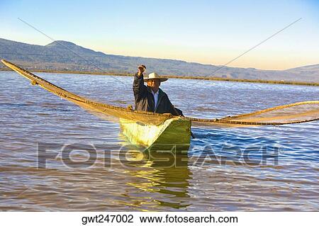 Fisherman with butterfly fishing net in a lake, Janitzio Island, Lake Patzcuaro, Patzcuaro, Michoacan State, Mexico View Large Photo Image Stock Image - Fisherman with butterfly fishing net in a lake, Janitzio Island, Lake Patzcuaro, Patzcuaro, Michoacan State, Mexico. Fotosearch