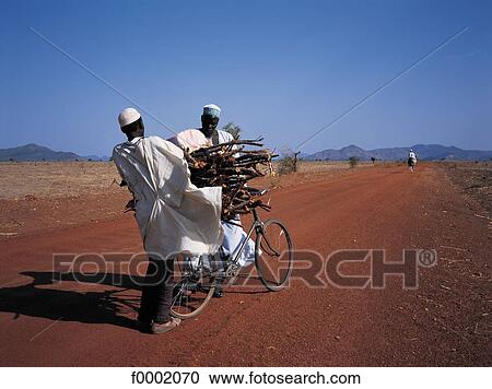 Stock Image - bike, bicycle, Central Africa, Cameroon, men, wood. Fotosearch