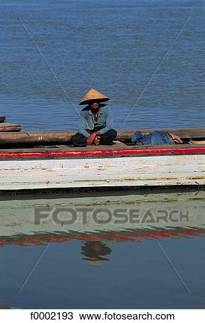 Stock Image - boat, river, Burma, Myanmar, South East Asia, Asia, fisherman. Fotosearch