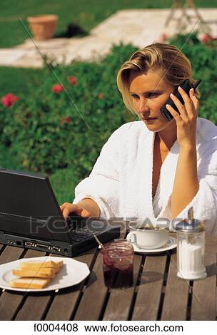 Stock Photo - breakfast, woman, women, phoning, on the phone, phone ctelephone caware, attention. Fotosearch