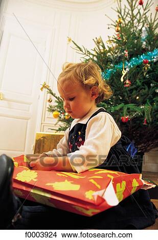 child, children, Christmas, Xmas, people, gift, offer View Large Photo Image Picture - child, children, Christmas, Xmas, people, gift, offer. Fotosearch
