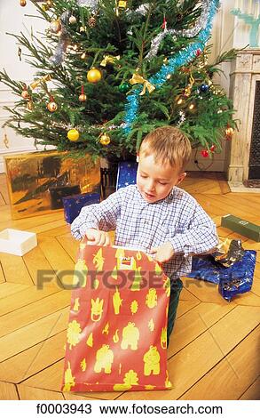 Stock Image - child, children, people, boy, gift, offer, present. Fotosearch
