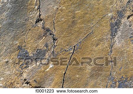 Stock Image - erosion, crack, stone, exterior, open air, background. Fotosearch