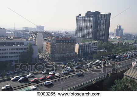 Stock Photography - Europe, France, French, French road, car, traffic, town. Fotosearch