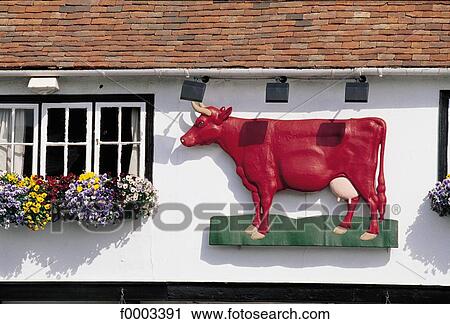 Stock Image - Europe, United Kingdom, England, Britain, traditional dwelling, front, shop sign. Fotosearch