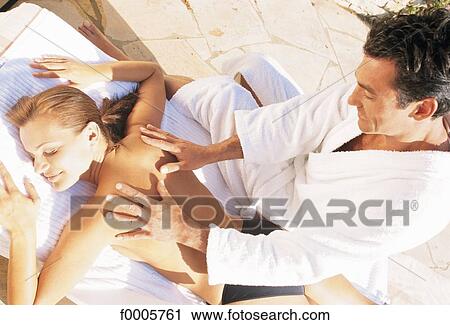 Stock Image - exterior, open air, back, massage, well-being, well being, serenity. Fotosearch