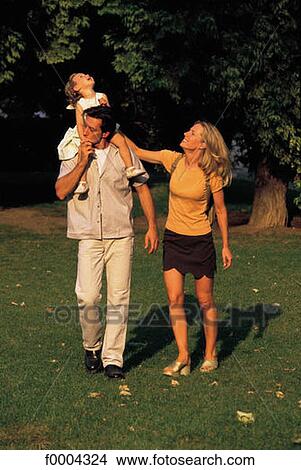 Picture - exterior, open air, people, family, father, daddy, dad. Fotosearch