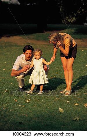 Stock Image - father, daddy, dad, couple, mother, mummy, mum. Fotosearch