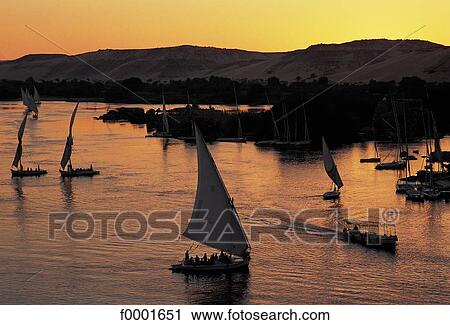 felucca, navigation, boat, sunset, setting sun, landscape, landscapes View Large Photo Image Stock Image - felucca, navigation, boat, sunset, setting sun, landscape, landscapes. Fotosearch
