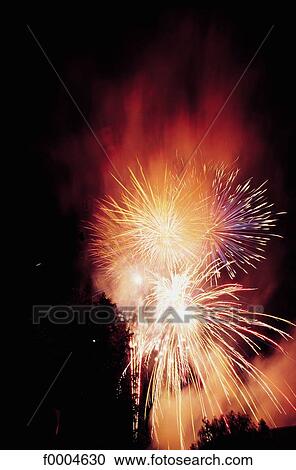 Stock Image - fireworks, celebration, sky, night, light, yellow, red. Fotosearch