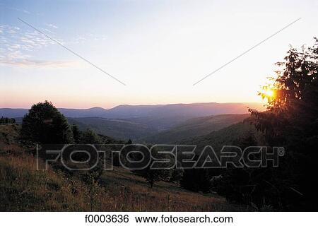Stock Photograph - general view, mountain, mountains, sunset, setting sun, landscape, landscapes. Fotosearch
