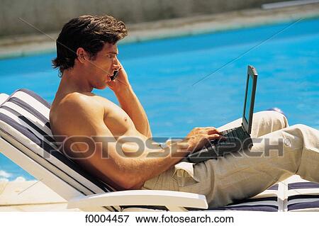 men, phoning, on the phone, phone ctelephone cdeck chair, business, aware View Large Photo Image Stock Photo - men, phoning, on the phone, phone ctelephone cdeck chair, business, aware. Fotosearch