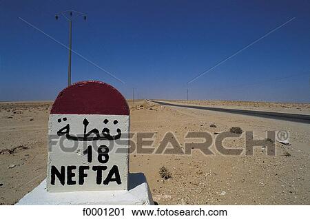 Stock Image - milestone, road sign, Tunisia, Northern Africa, South Tunisia, exterior. Fotosearch